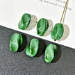 7*14mm Czech Glass Emeral Green Twisted Barrel