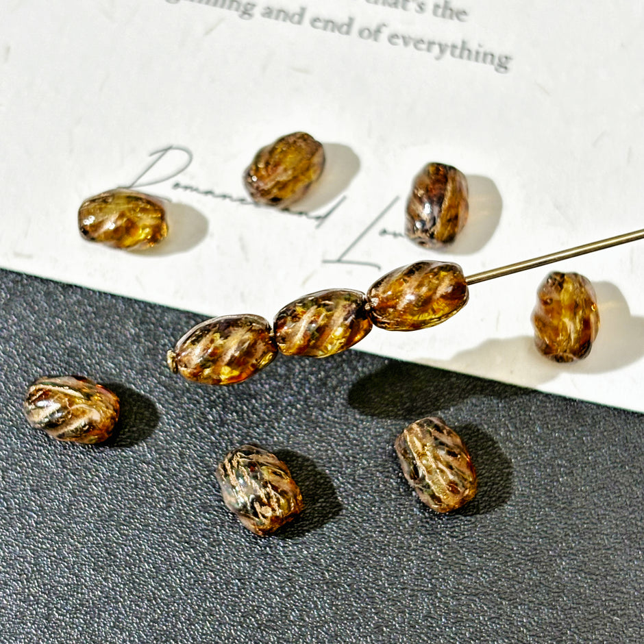 5x7mm Czech Glass Carved Barrel Beads - Translucent Amber Picasso