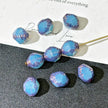 7x9mm Czech Glass Turbine Beads - Opal Blue with Purple & Gold Accents