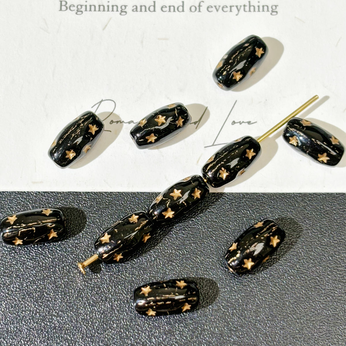 4x9mm Czech Glass Pressed Star Barrel Beads - Black & Metallic Gold