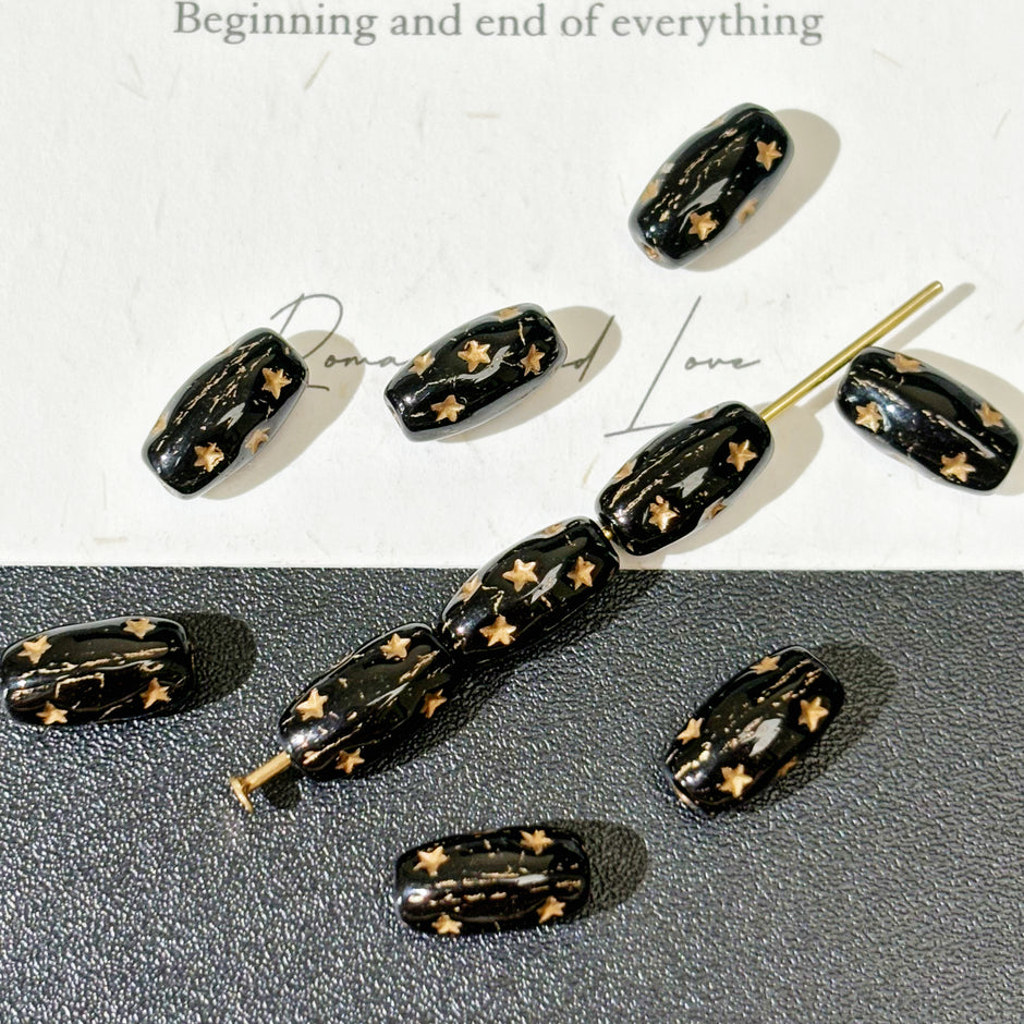 4x9mm Czech Glass Pressed Star Barrel Beads - Black & Metallic Gold